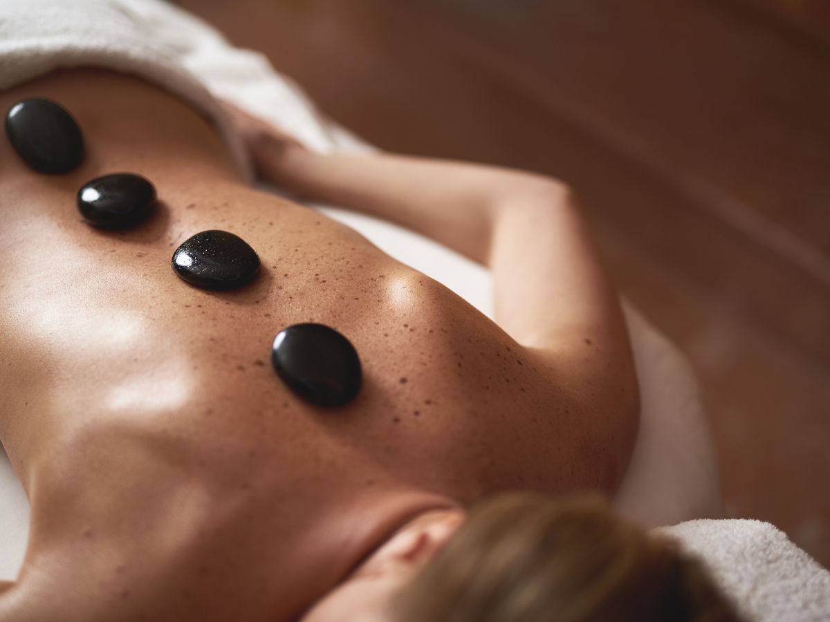 Hot stone therapy on the back